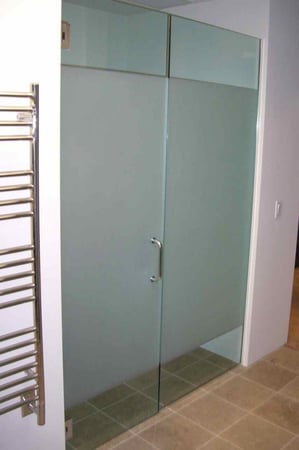 Shower Enclosure showcasing a Frosted Glass Geometric Design with Sandblast Etched Glass Art by Sans Soucie Solid Band Design