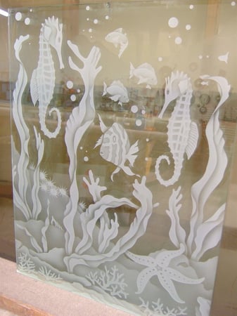Window showcasing a Frosted Glass Oceanic Design with Sandblast Etched Glass Art by Sans Soucie Aquarium Seahorse Design