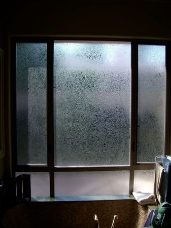 Window showcasing a Frosted Glass Plain Solid Gluechip Overall Design with Sandblast Etched Glass Art by Sans Soucie Plain Gluechip Overall Design