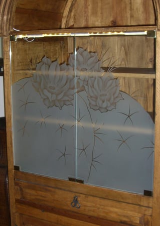 Cabinet Glass showcasing a Frosted Glass Desert Design with Sandblast Etched Glass Art by Sans Soucie Blooming Barrel Cactus Design