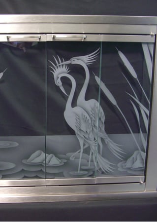 Fireplace Screen showcasing a Frosted Glass Wildlife Design with Sandblast Etched Glass Art by Sans Soucie Cranes & Cattails Design