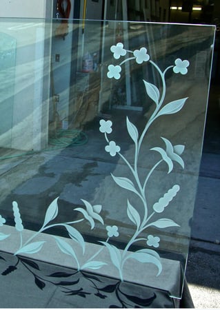 Fireplace Screen showcasing a Frosted Glass Floral Design with Sandblast Etched Glass Art by Sans Soucie Delicate Design