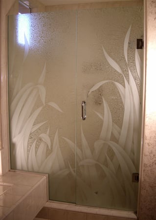 Shower Enclosure featuring Frosted Glass Design Etched Glass by Sans Soucie Art Glass with Custom Foliage Design Reeds