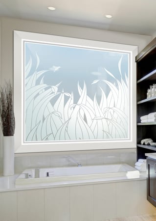 Window showcasing a Frosted Glass Foliage Design with Sandblast Etched Glass Art by Sans Soucie Reeds Tall Hummingbird Design