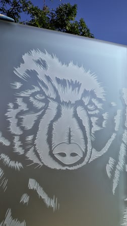 Partition showcasing a Frosted Glass Wildlife Design with Sandblast Etched Glass Art by Sans Soucie Grizzly Design