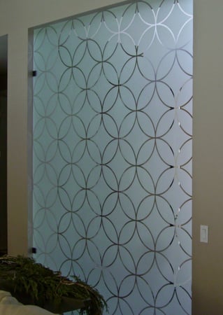 Partition featuring a Frosted Glass Geometric Design Sandblast Etched Glass Circles Intersecting Small Scale Design by Sans Soucie
