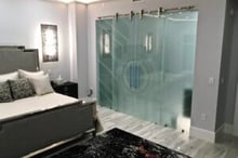 Best glass barn doors for master bedroom and bathroom closet featuring double frosted glass panels with a Sun Odyssey design, offering full privacy and a modern, artistic look.
