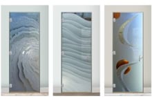 Frameless interior glass doors with modern etched and carved designs, featuring abstract and wave-inspired patterns.