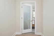 Modern bathroom door opening inward showing swing direction for space and layout design