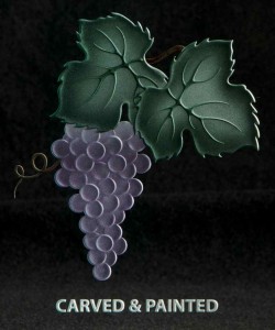 This grape cluster has been carved and painted.  Adding color to the design creates a very dramatic finish.