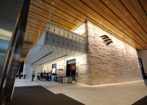 The tree bark texture glass is suspended as a large "cube" of ceiling glass, inside the main lobby entrance.