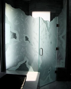 "Arctic" shower enclosure, features heavy glass overlay pieces, chiseled edges and a stunning random texture.  The shower is being illuminated by the window on the opposite wall.  Commissioned by Susan Schreiber Interior Designs.
