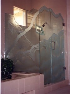 "Rugged Retreat" gives the illusion of multi-layers with waves crossing over one another.  Note the "matching mirror" inside the shower, the edges are chiseled and waves are etched and 3-dimenssionally sculpture carved.