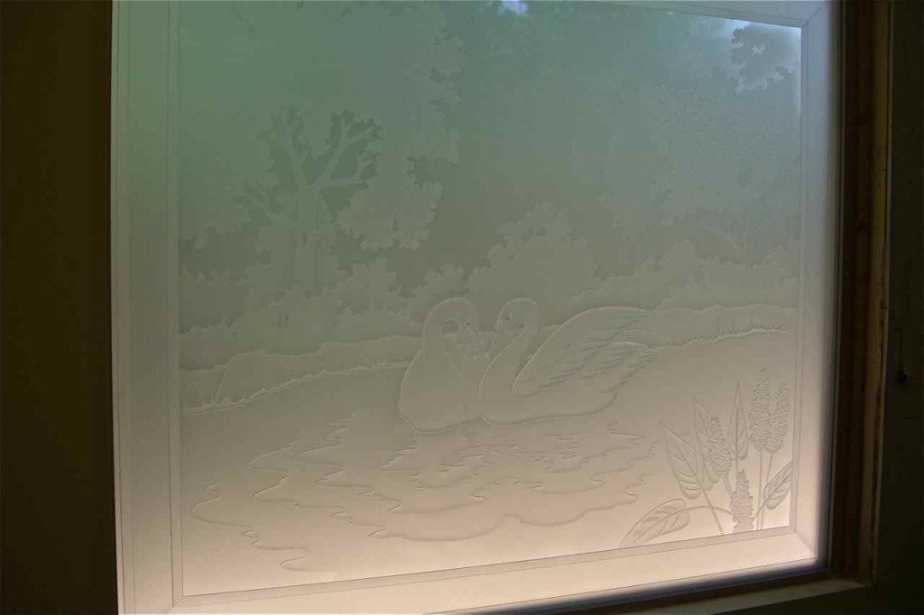 etched glass window swans lake trees landscape