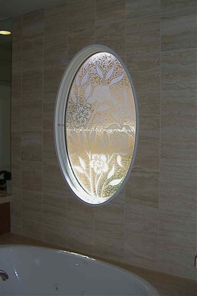 Decorative glass tub window, etched carved glass hibiscus flowers, with a butterfly and a gluechipped glass background, for added obscurity.