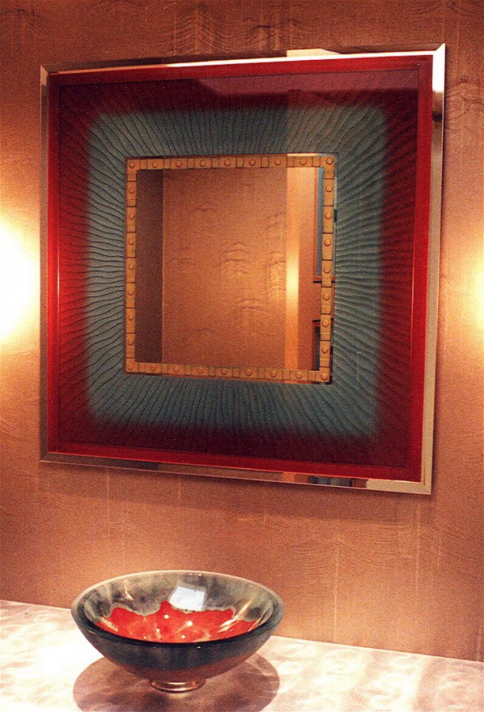 "Vibrance" etched, carved bathroom vanity mirror with beveled edges.