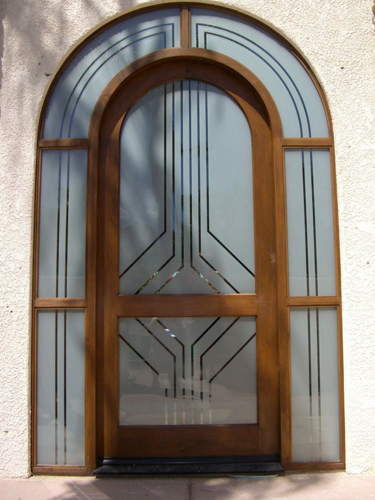 Sleek pinstripes are featured in this Glass Entry of etched glass with clear pinstriping