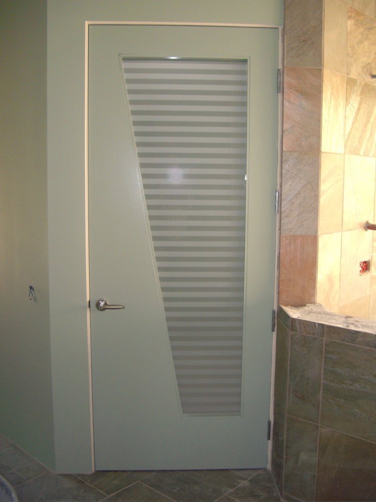 Horizontal etched and lightly frosted bands are featured on this door glass, that is cut at angle for a really contemporary look.