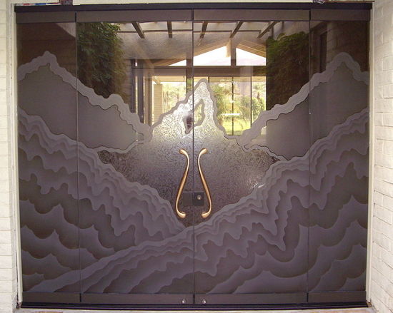 Frameless Glass Entry, bronze glass etched and carved with Rugged Retreat design.