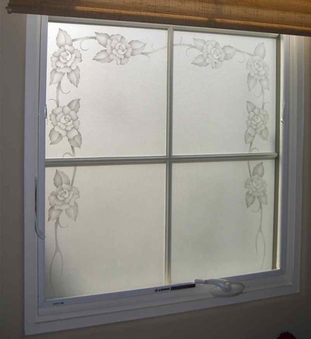 A very accurate example of a true "etched glass window", this window features a border of roses, that have been ETCHED AND SHADED, with the background solid etched glass.  These privacy windows do not diminish the amount of light coming into the room, but they do beautifully reduce GLARE.