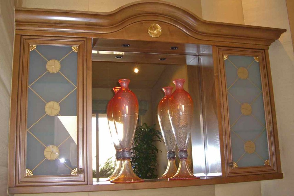 Custom Frosted Cabinet Glass, featuring dimensionally carved and gold hand painted bands and cabinet details.