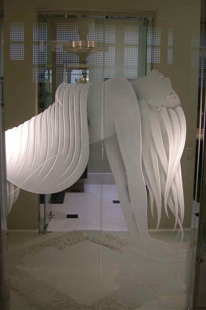 Luxury etched glass shower doors with custom artistic frosted design.