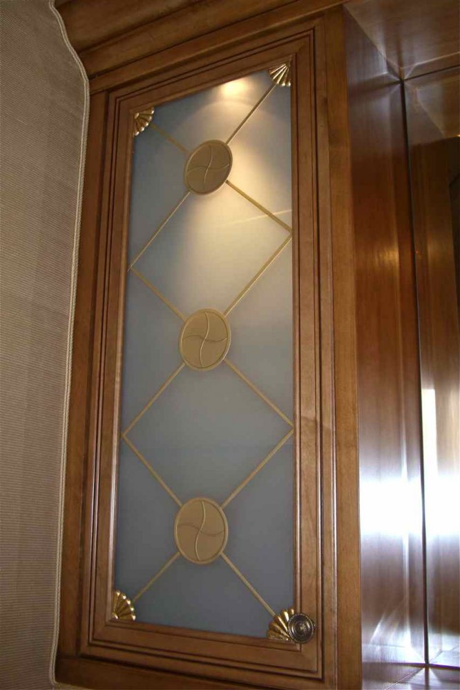 Kitchen cabinet with minimalist carved details