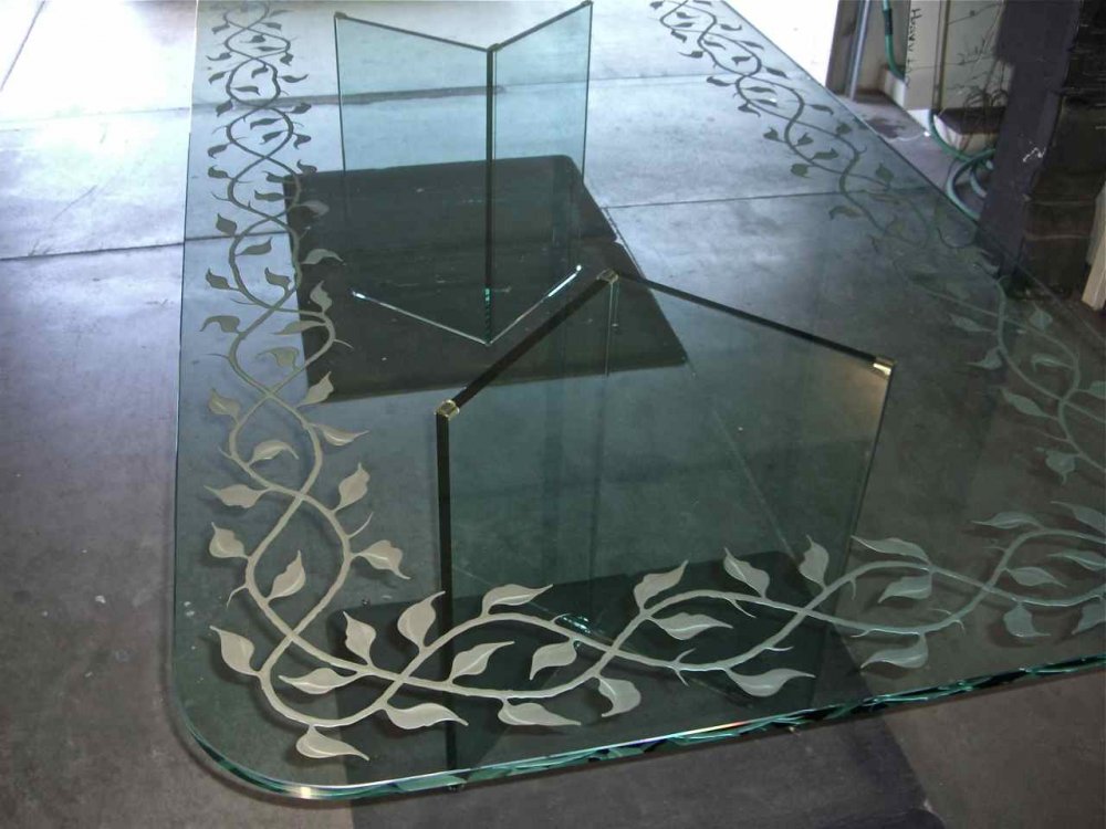 Glass table with etched elegant vines