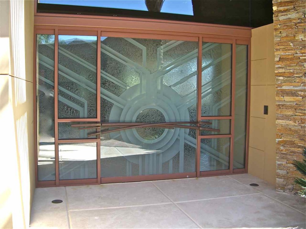Premium decorative frosted glass entry feature with a custom Art Deco design, enhancing curb appeal, architectural character, and home value