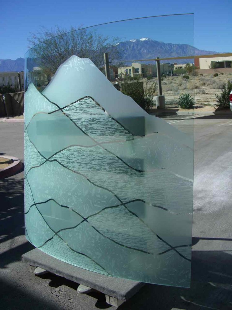 Abstract glass partition panel featuring layered hills and mountain-inspired contours in 3D carved, frosted, and textured architectural glass for modern interiors.