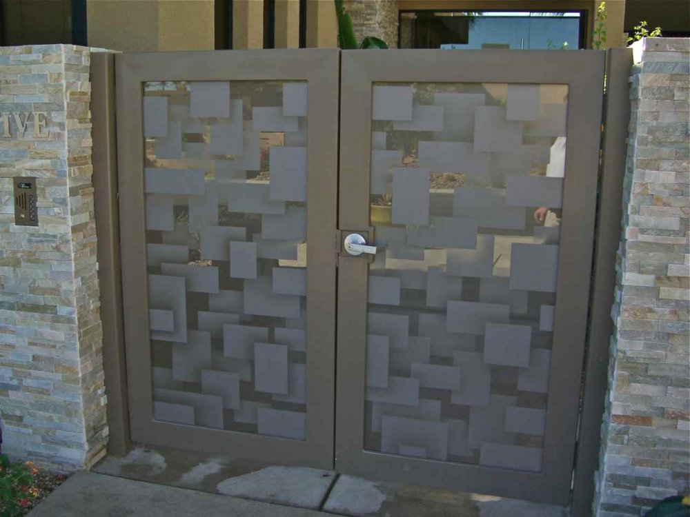 Modern etched glass entry gate with floating squares pattern and frosted glass inserts, combining privacy with contemporary design.