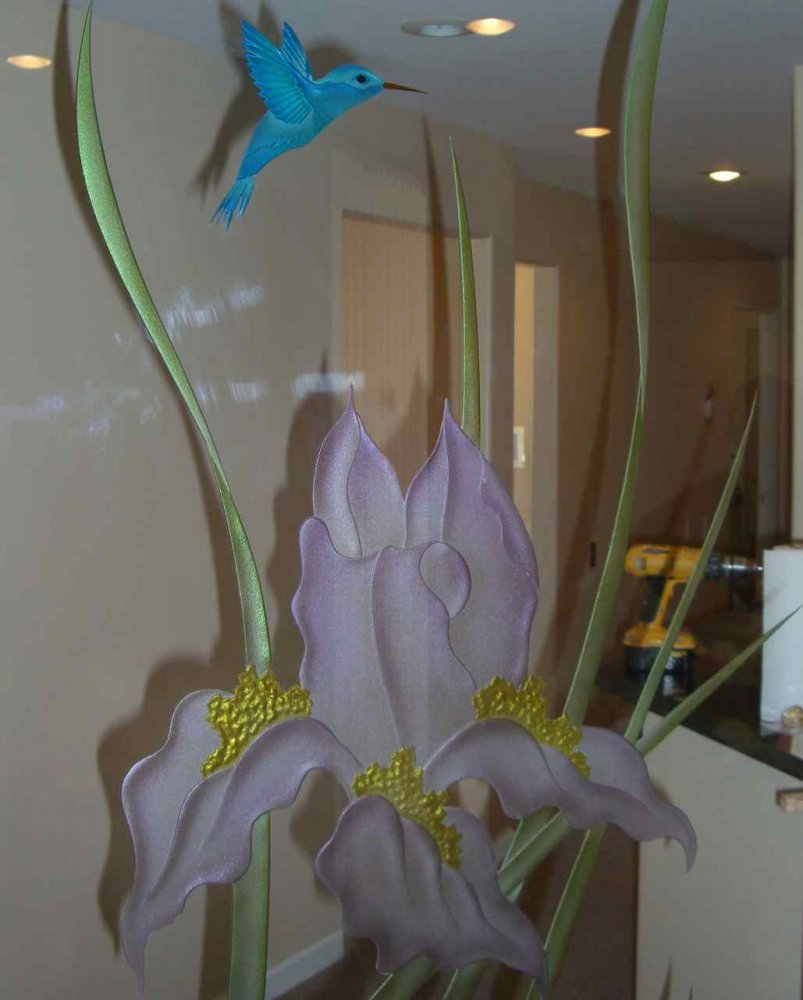 Etched glass door with tropical iris flowers and hummingbird, 3D carved and hand painted on clear glass background.