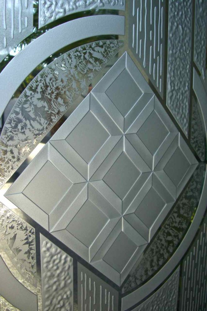 3D carved geometric frosted glass design showing light diffusion and shadow depth across etched glass surface