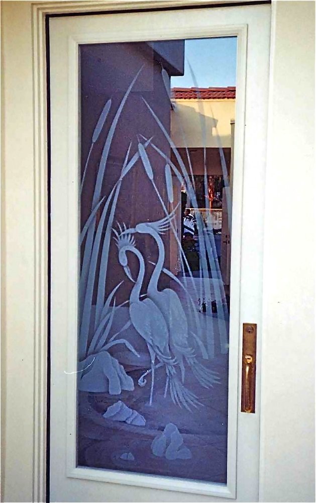 Front door with decorative frosted glass featuring crane and cattails design with clear background for partial privacy and natural light