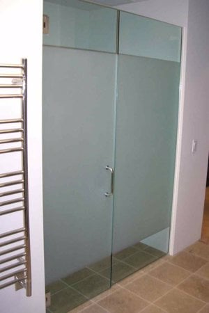 Shower Enclosure showcasing a Frosted Glass Geometric Design with Sandblast Etched Glass Art by Sans Soucie Solid Band Design