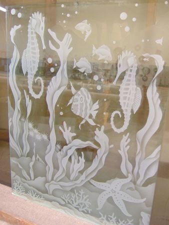 Window showcasing a Frosted Glass Oceanic Design with Sandblast Etched Glass Art by Sans Soucie Aquarium Seahorse Design