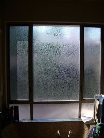 Window showcasing a Frosted Glass Plain Solid Gluechip Overall Design with Sandblast Etched Glass Art by Sans Soucie Plain Gluechip Overall Design
