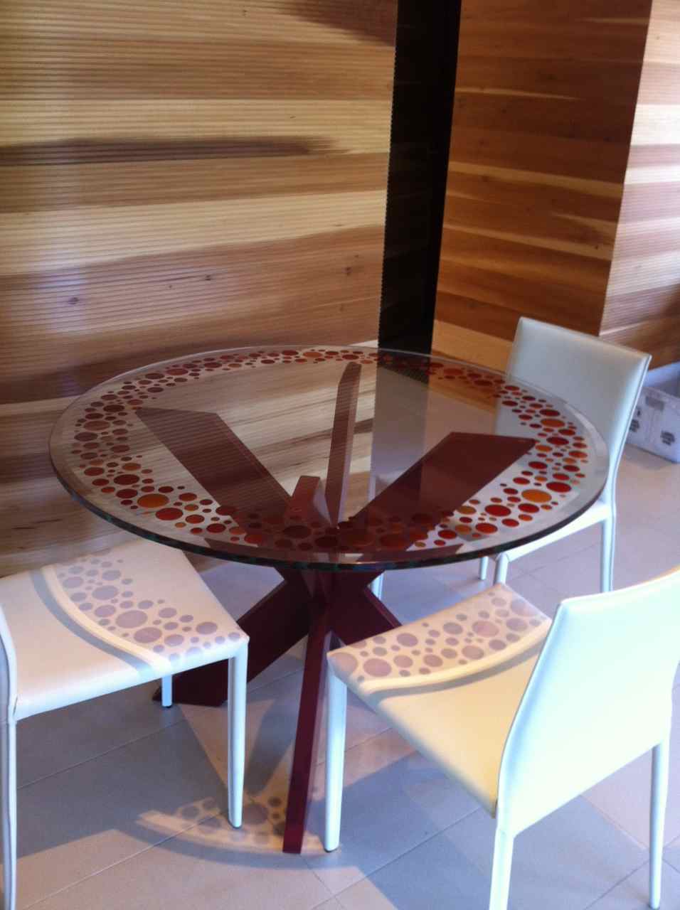 round glass dining table orange circles