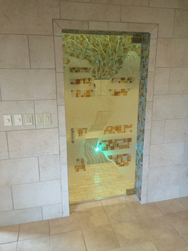 Custom-Designed Decorative Shower Door with Sandblast Etched Glass by Sans Soucie Art Glass Handcrafted by Glass Artists