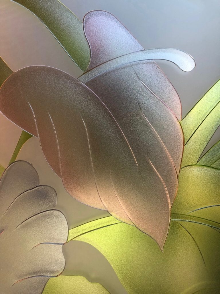 Close-up of tropical anthurium leaves on 3D enhanced frosted glass with soft translucent hand-painted green tones.