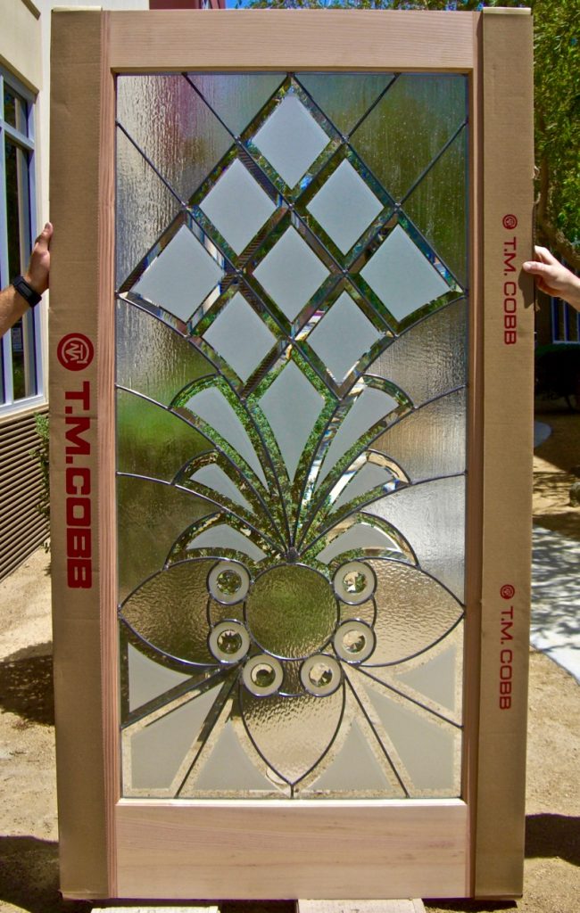 Stunning beveled glass door with diamond bevels and textured glass in a wood entry door frame