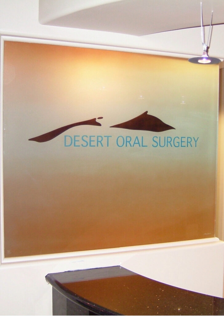 Etched glass partition featuring a corporate logo design