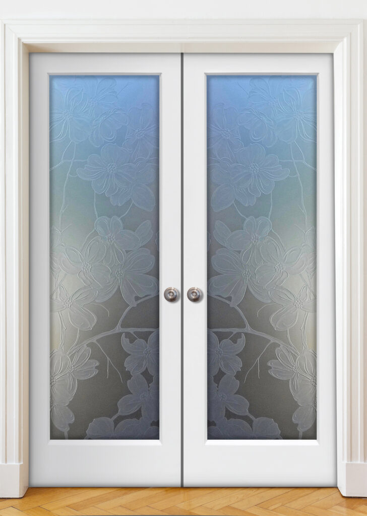 Double interior doors with carved and shaded Dogwood design