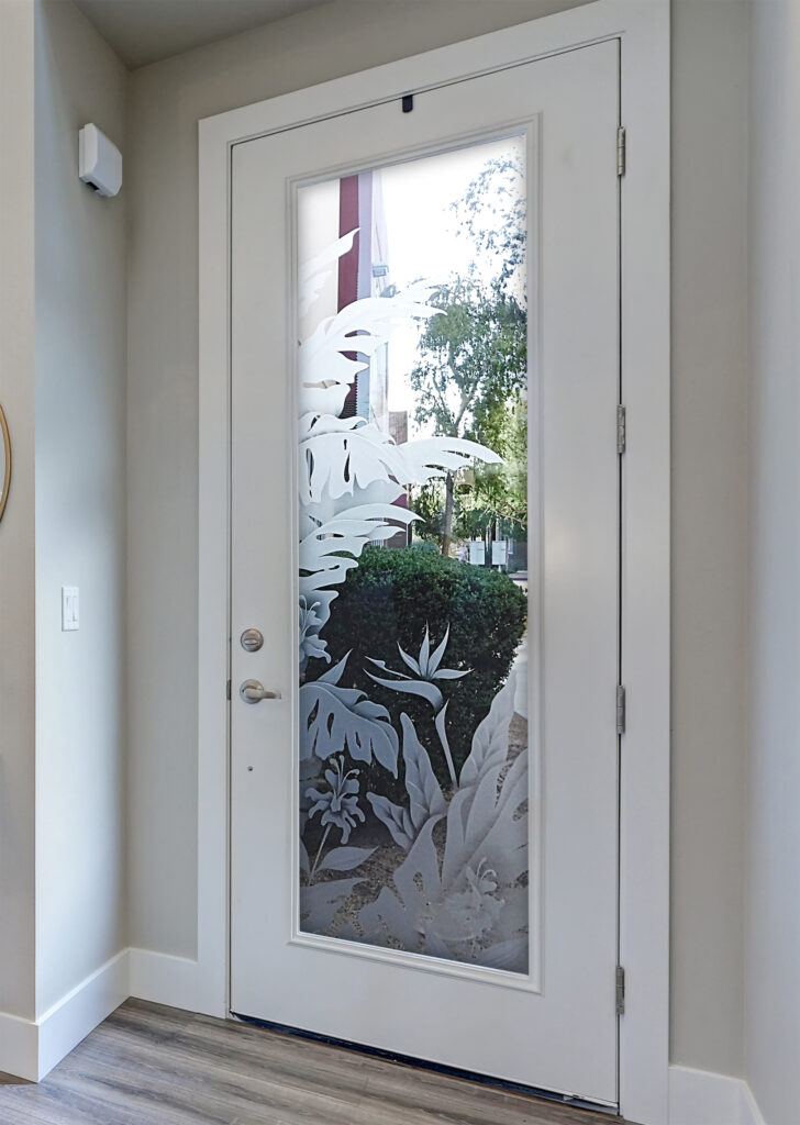 Etched glass door with tropical foliage design