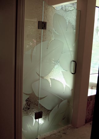 Shower Enclosure featuring a Frosted Glass Tropical Design Sandblast Etched Glass Banana Leaves Design by Sans Soucie