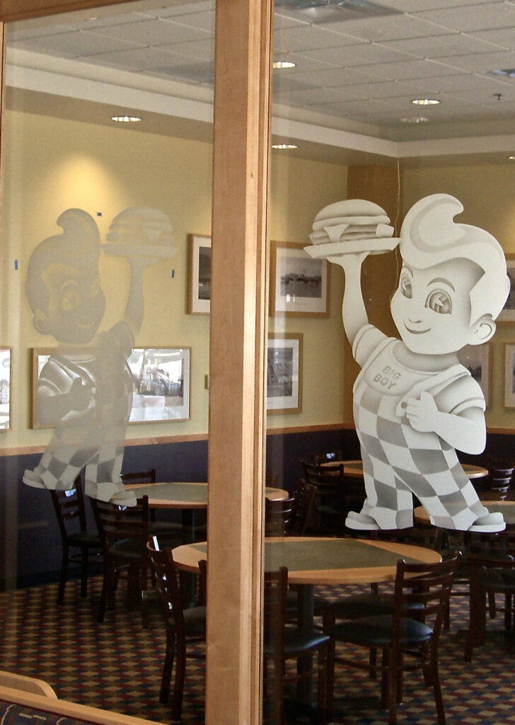 Glass wall partition with art and logo for commercial spaces