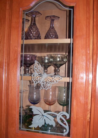 Cabinet Glass showcasing a Frosted Glass Borders Design with Sandblast Etched Glass Art by Sans Soucie Butterfly Leaf Border Design