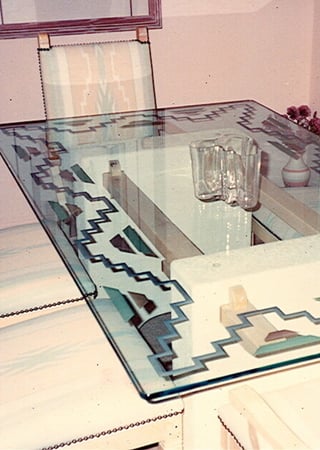 Glass Dining Table showcasing a Frosted Glass Borders Design with Sandblast Etched Glass Art by Sans Soucie Chevrons Aztec Border Design