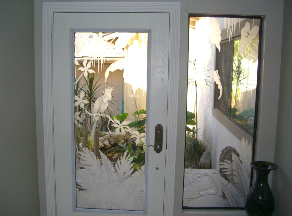 Etched glass door with tropical plants and cockatoo design