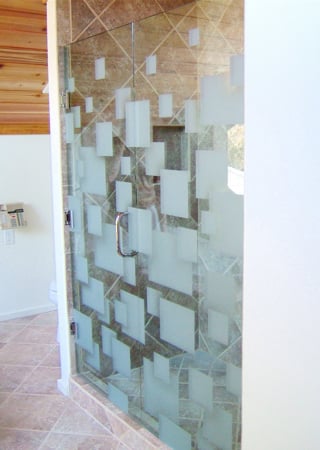 Shower Enclosure showcasing a Frosted Glass Geometric Design with Sandblast Etched Glass Art by Sans Soucie Cubes Design